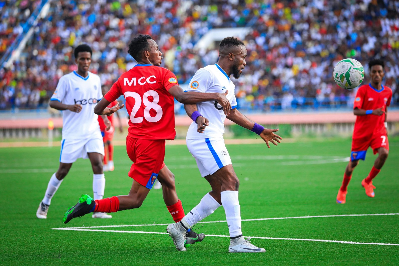 Soccer players competing fiercely during a match in Mogadishu, Somalia.